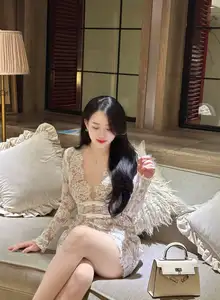 Captivating Beauty: Young Woman in Elegant Lace Dress Shines in Luxurious Restaurant Setting.-13