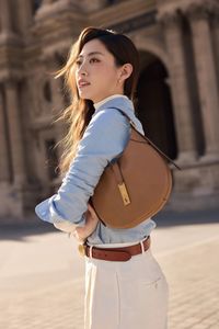 Elegant Paris Style: Woman in Trench Coat at the Louvre-3