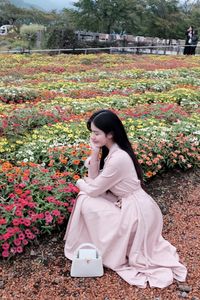 Nature and Girl: Elegant Beauty Amidst a Vibrant Flower Garden-0