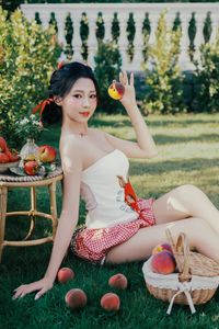 Beautiful Woman Enjoying Fresh Summer Peaches in a Lush Garden Setting, Healthy Lifestyle Inspiration.-7