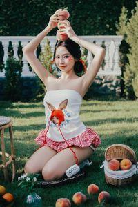 Beautiful Woman Enjoying Fresh Summer Peaches in a Lush Garden Setting, Healthy Lifestyle Inspiration.-11