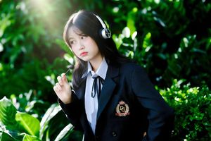 Discover the captivating smile of an Asian girl amidst vibrant nature-2