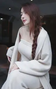 Discover the elegant charm of a gentle woman captured in a serene, thoughtful moment 176403855-7