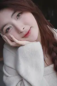 Discover the elegant charm of a gentle woman captured in a serene, thoughtful moment 176403855-3