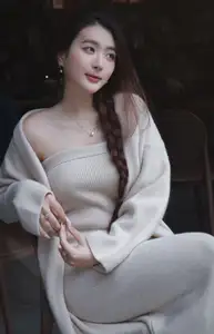 Discover the elegant charm of a gentle woman captured in a serene, thoughtful moment 176403855-2