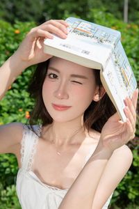 Elegant Young Woman in White Dress Amidst Greenery | Natural Summer Beauty-7