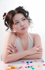 Sweet Charm of Young Girl Winking with Colorful Candies-3