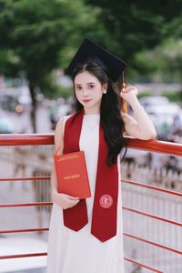 Beautiful Female Graduate Embraces Success at Graduation Ceremony-5