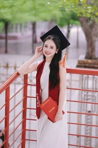 Beautiful Female Graduate Embraces Success at Graduation Ceremony-15