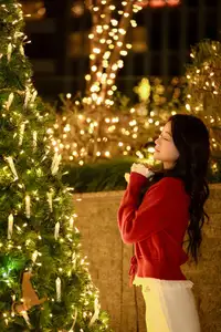 Radiant Smile Girl in Red Amidst Twinkling Lights: Warm Beauty for Festive Season-9