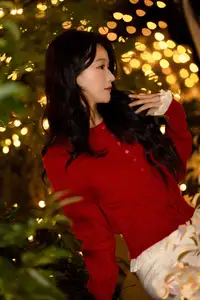 Radiant Smile Girl in Red Amidst Twinkling Lights: Warm Beauty for Festive Season-5