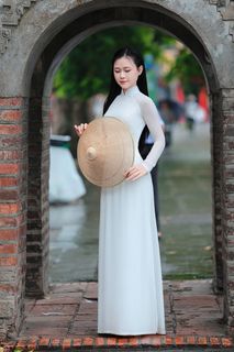 Vietnamese Ao Dai Beauty: Elegant Young Woman by Hoan Kiem Lake, Traditional Charm.-0