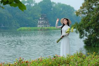 Vietnamese Ao Dai Beauty: Elegant Young Woman by Hoan Kiem Lake, Traditional Charm.-3