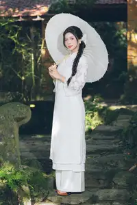 Charming Young Woman in White Lace & Orchids: Radiant Natural Beauty Amidst Greenery 1000026906-13