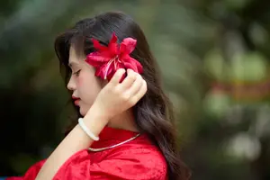 Graceful Vietnamese Beauty: Traditional Ao Dai Adorned with a Vibrant Red Flower-18