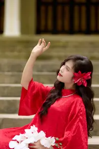 Graceful Vietnamese Beauty: Traditional Ao Dai Adorned with a Vibrant Red Flower-9
