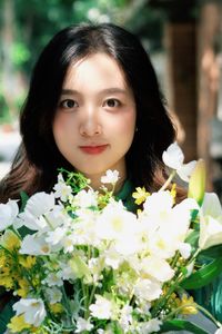 Captivating Smile: Young Woman in Green Embraces Nature's Serenity 1000019864-3