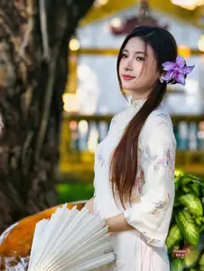 Graceful Ao Dai: Explore the Timeless Traditional Beauty of a Vietnamese Girl with an Elegant Parasol in a Lush Garden Setting-1