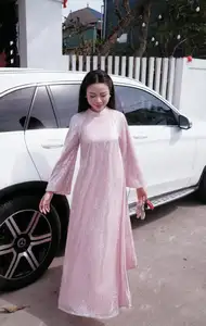 Phan Van Duc's Wife Stuns in Elegant Traditional Ao Dai Amidst Ancient Charm-4