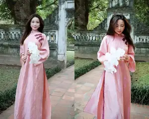Phan Van Duc's Wife Stuns in Elegant Traditional Ao Dai Amidst Ancient Charm-3