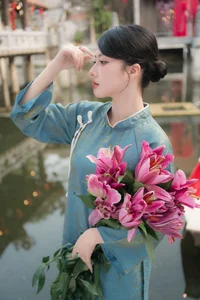 Classic Elegance: Vietnamese Tradition in Blue Silk and Pink Lilies-10