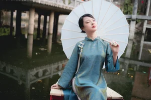 Classic Elegance: Vietnamese Tradition in Blue Silk and Pink Lilies-6