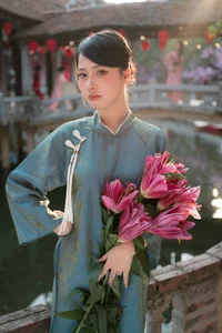 Classic Elegance: Vietnamese Tradition in Blue Silk and Pink Lilies-0