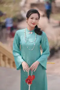 Captivating Charm: Vietnamese Girl's Elegance in a Stunning Mint Green Ao Dai-14