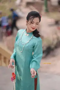 Captivating Charm: Vietnamese Girl's Elegance in a Stunning Mint Green Ao Dai-3
