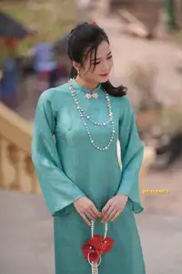 Captivating Charm: Vietnamese Girl's Elegance in a Stunning Mint Green Ao Dai-6