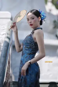 Captivating Asian Beauty: Elegant Woman in Blue Cheongsam with Traditional Fan-5