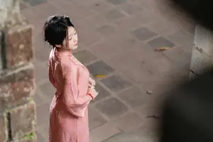 Graceful Asian Young Woman in Traditional Pink Attire: Timeless Beauty by an Ancient Wall-11