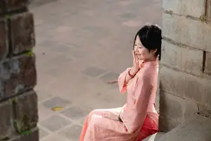 Graceful Asian Young Woman in Traditional Pink Attire: Timeless Beauty by an Ancient Wall-7