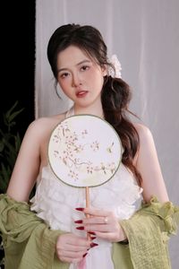 Elegant Vietnamese Girl in White, Embracing Tea Ceremony and Lotus Flowers – Traditional Beauty.-3