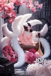 Mesmerizing Nine-Tailed Fox Cosplay: Ethereal Beauty in a Cherry Blossom Garden-8