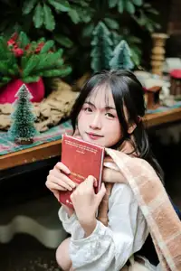 Cozy Christmas Reading: Young Woman and 'How to Win Friends' Book-3