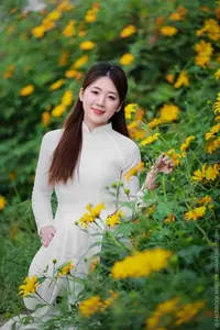 Radiant Youth: Vietnamese Girl in Elegant White Ao Dai Amidst Golden Blooms-17
