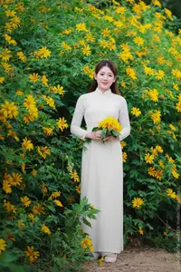 Radiant Youth: Vietnamese Girl in Elegant White Ao Dai Amidst Golden Blooms-20