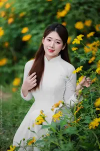 Radiant Youth: Vietnamese Girl in Elegant White Ao Dai Amidst Golden Blooms-19