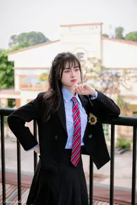 Graceful Vietnamese Girl in Elegant White Ao Dai with Sweet Finger Heart Gesture-7