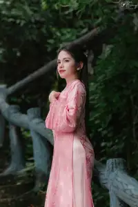 Pink Ao Dai Charm: Discover the Ethereal Beauty of Vietnamese Women in Ancient Heritage Settings.-3