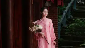 Pink Ao Dai Charm: Discover the Ethereal Beauty of Vietnamese Women in Ancient Heritage Settings.-4