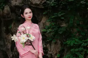 Pink Ao Dai Charm: Discover the Ethereal Beauty of Vietnamese Women in Ancient Heritage Settings.-2