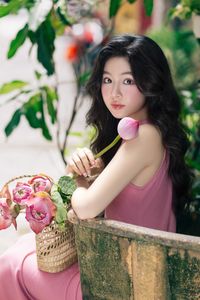 Vietnamese Grace: Elegant Girl in Traditional Flower Market, Discover Vibrant Culture 1000019476-6