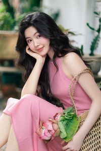 Vietnamese Grace: Elegant Girl in Traditional Flower Market, Discover Vibrant Culture 1000019476-0