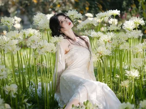 Ethereal Beauty in a White Flower Field: A Muse Under the Sun-0