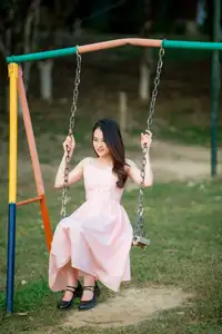 Serene Beauty: Young Woman in Pink Dress Amidst a Vibrant Flower Field-6