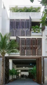 Modern Eco-Friendly Home Design Inspired by Tropical Coconut Leaves in Ho Chi Minh City: A Sustainable Architectural Masterpiece with Split-Level Living-2