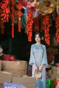 Traditional Vietnamese Beauty: Graceful Girl in Blue Ao Dai with Fresh Flowers-10