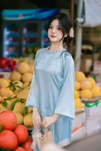 Traditional Vietnamese Beauty: Graceful Girl in Blue Ao Dai with Fresh Flowers-14